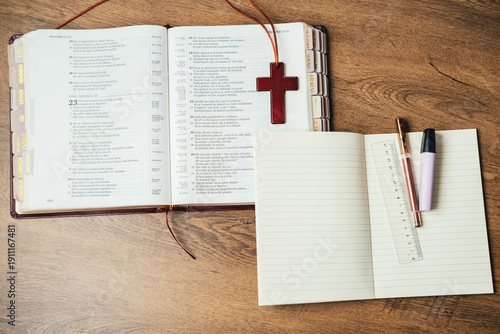 Foto Engaging In Biblical Study Equipped With Writing Utensils And Meaningful Religio