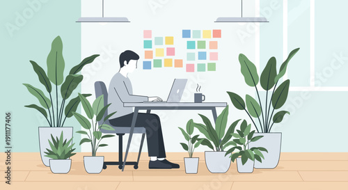 Man working on laptop surrounded by plants in a modern office with natural light