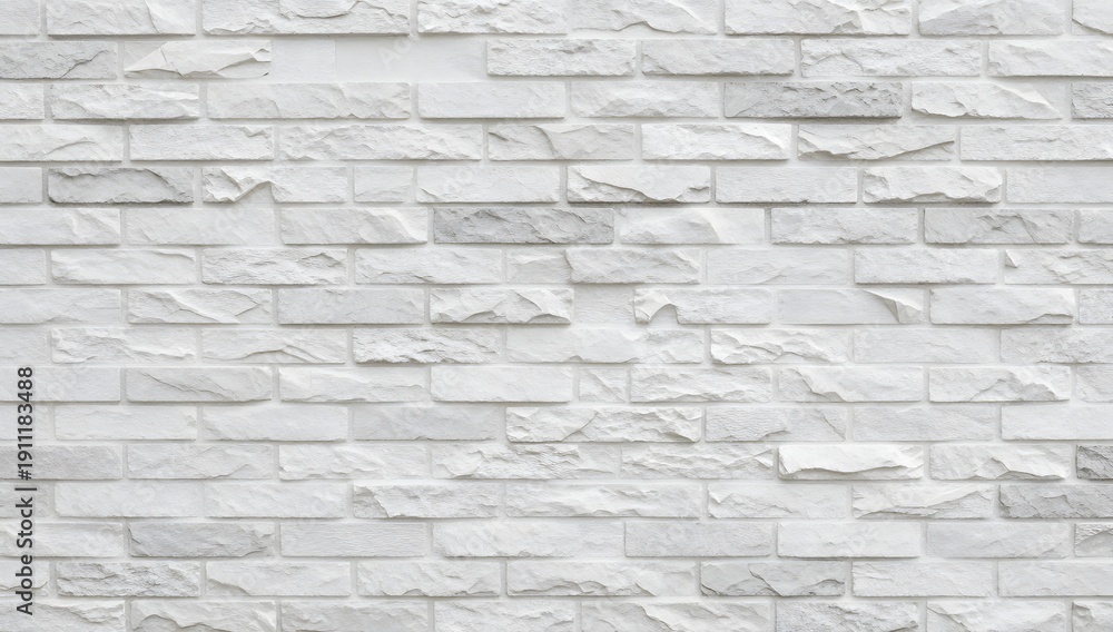 Fototapeta premium Monochromatic brick wall exhibits a subtle gradient in color and texture