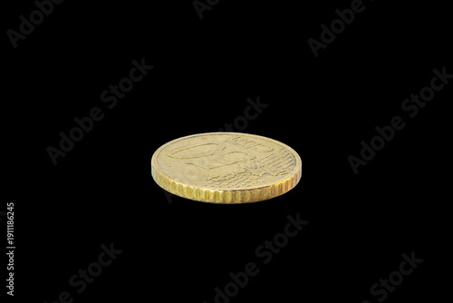 Side-angle view of a 50-cent Euro coin's reverse. Features the face value and European map on a golden-toned Nordic gold surface, isolated on a plain transparent black background.