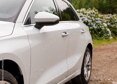 Wallpaper Mural Low angle view of side back rear part of modern white new car. automobile perspective on countryside. Torontodigital.ca