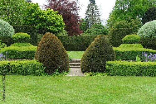 Scenic View of a Grass Lawn and Leafy Trees in a Beautiful English Style Garden