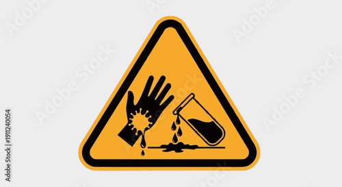 Yellow warning sign indicating corrosive hazard with a hand being burned by spilled liquid from a test tube.