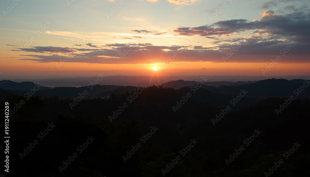 Naklejka premium Golden evening above jungle hills