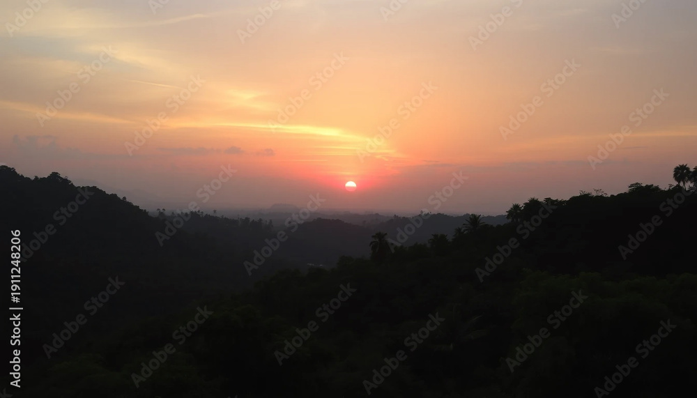 Obraz premium Majestic sunset horizon glowing softly above jungle