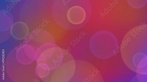 Abstract background video loop featuring colorful glowing bokeh lights moving and fading across a vibrant gradient backdrop of neon pink orange and purple. Ideal for overlays titles presentations