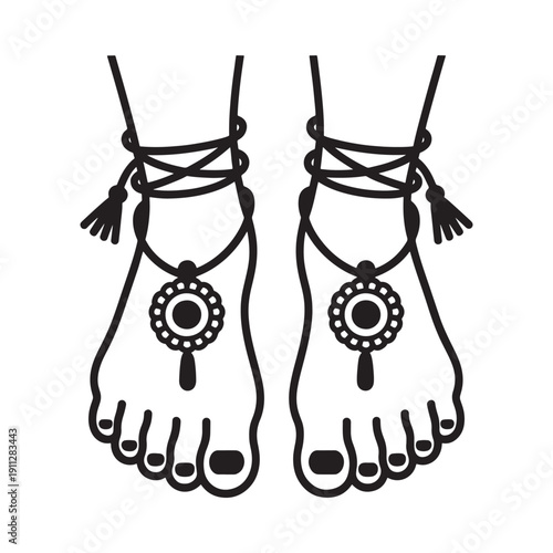 A pair of bare feet adorned with delicate anklets and floral pendants