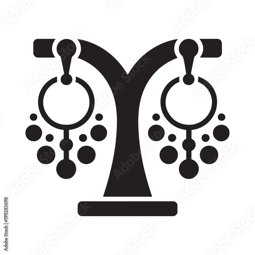 Black silhouette of a jewelry display stand with ornate earrings
