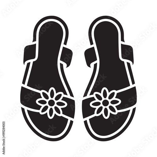 A pair of black silhouette sandals decorated with floral embellishments
