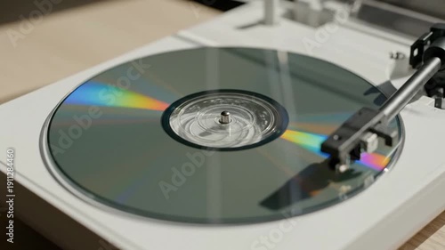 Close-up of CD player. Portable CD Player Retro Style. Vintage Compact Disc Player. 90s Nostalgia Music Device. Classic Audio Technology Gadget. White CD player. Silver turntable. Rainbow