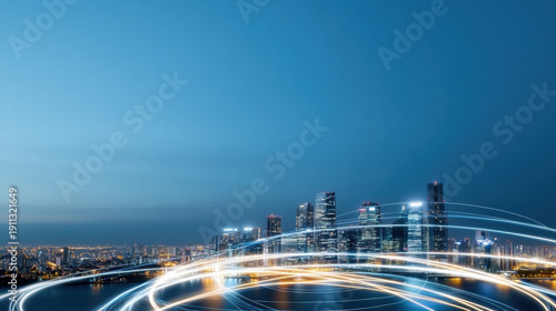 Smart city skyline at night with glowing light trails symbolizing digital connection and modern technology in urban environment