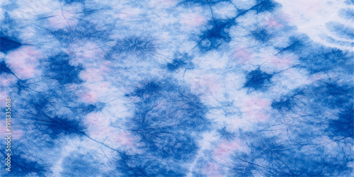 A beautiful clear blue sky background with fluffy white clouds and bright sunlight creates a stunning abstract nature view of heaven on a high summer day