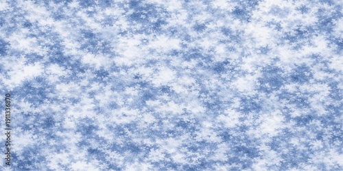 A beautiful clear blue sky background with white fluffy cumulus clouds creates a natural abstract cloudscape on a sunny summer day