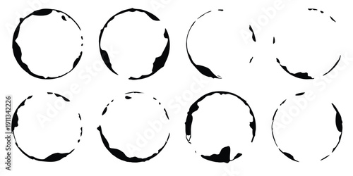Set of black ink circle brush strokes with grunge texture. Abstract hand drawn round frames isolated on light background. Artistic paint ring collection for , stamp, and design elements. 