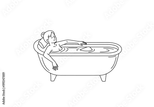 Relaxing woman soaking in bathtub with eyes closed enjoying peaceful warm water at home for self care and wellness