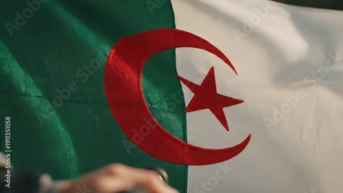 Algeria flag waves during ceremony video frames.