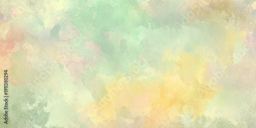 A soft and gentle watercolor wash featuring pastel hues of green yellow and peach tones creating a blurred effect
