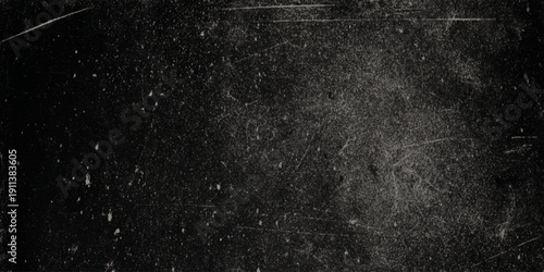 A textured black wall background with subtle scratches dust particles and a grainy appearance suggesting aged film