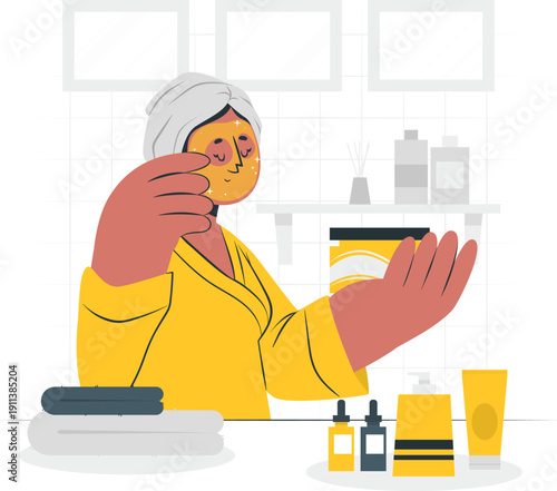 Woman in yellow robe applying facial cream in a serene bathroom setting, viewed from the side with various skincare products nearby