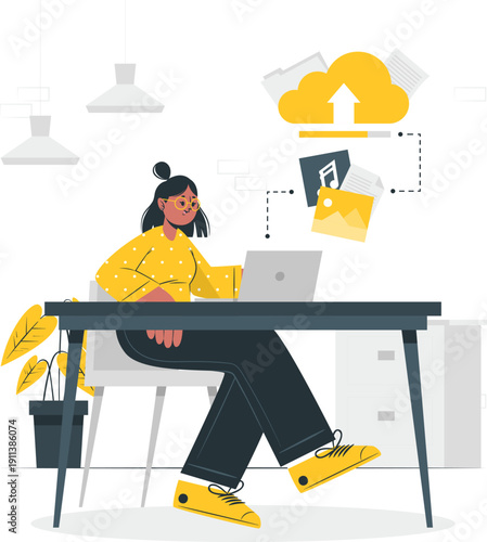 A young woman working on a laptop with files uploading to the cloud from her desk in a modern office environment viewed from the side.