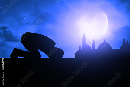 Silhouette of muslim man praying at blue night sky with stars and moon, eid adha mubarak concept