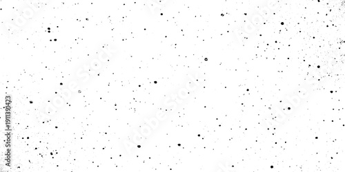 Black dust and speckle grain texture on white background for vintage film effect aged paper effects, or industrial wear and tear in graphic design.