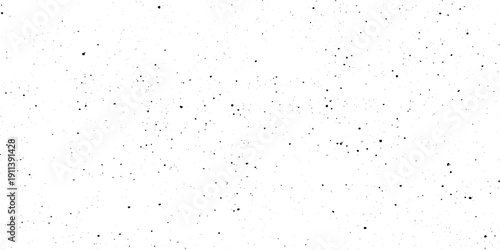 Black dust and speckle grain texture on white background for vintage film effect aged paper effects, or industrial wear and tear in graphic design.