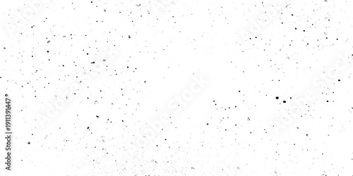 Black dust and speckle grain texture on white background for vintage film effect aged paper effects, or industrial wear and tear in graphic design.