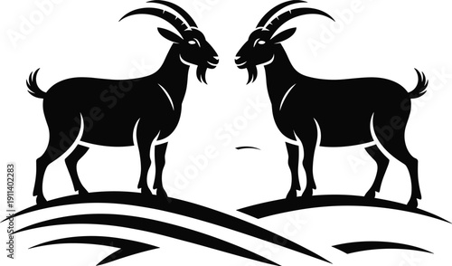 Black silhouette of two mountain goats with horns standing on a hill facing each other isolated on white background for nature and farming concept