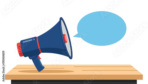 Colorful megaphone with speech bubble on wooden table