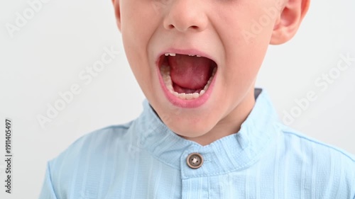 Wallpaper Mural The happy child laughs, showing the gap from the missing baby tooth Torontodigital.ca