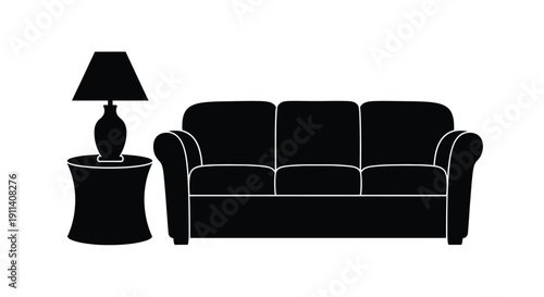 Black furniture arrangement with a sofa and lamp a bold silhouette