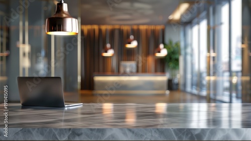 Modern reception area in a corporate building with a sleek desk, laptop, and stylish seating, featuring ambient lighting and elegant decor.