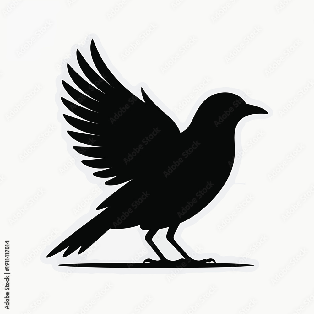 Fototapeta premium Black bird silhouette with wings spread on white background