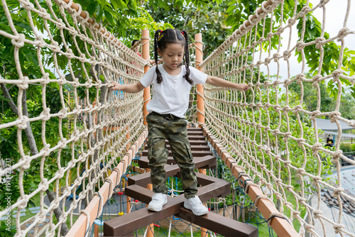 Asian girl playing with a rope.