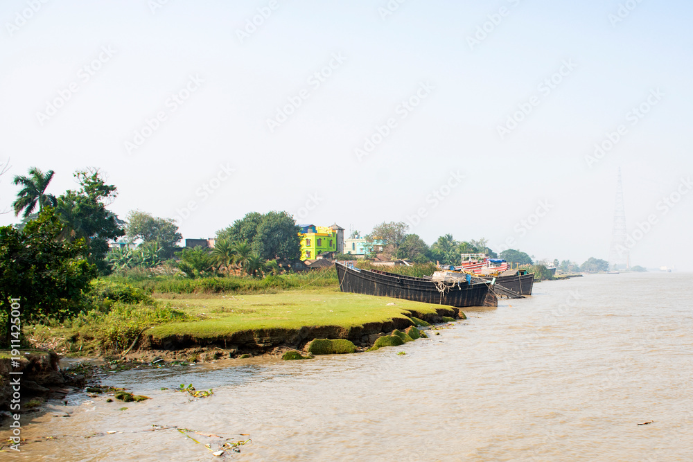 Fototapeta premium Fishing Trawlers Anchored on Indian Coastal River Awaiting Deep Sea Voyage