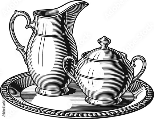 Vintage silver pitcher and sugar bowl with lid on ornate serving tray engraving