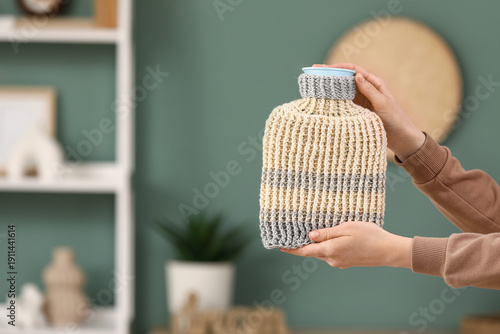 Female hands with hot water...