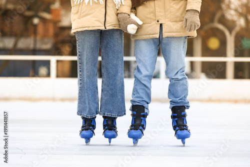 Young couple holding hands ...