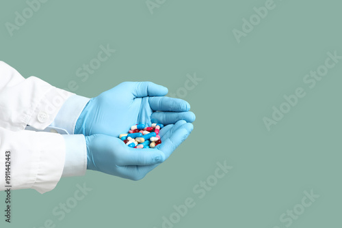 Hands of doctor with pills ...