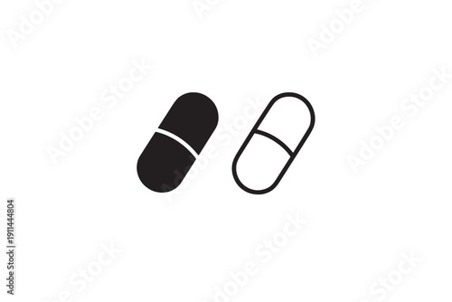 Black and white capsule pills side by side medication