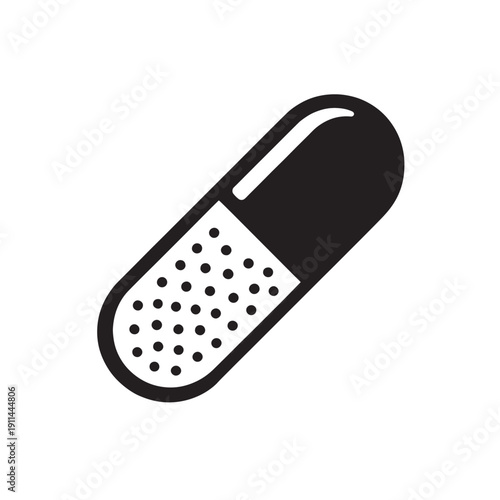 Black and white capsule pill with dots