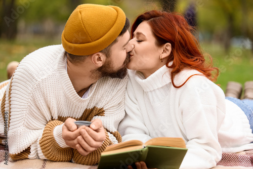 Cute young couple in warm s...