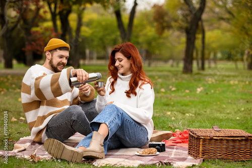 Cute young couple in warm s...