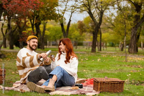 Cute young couple in warm s...