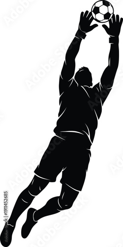 Silhouette of a soccer player jumping to catch a ball