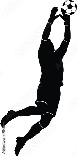 Silhouette of a soccer goalkeeper jumping to catch a ball