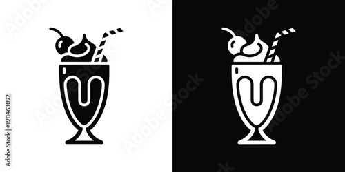 Black and white cocktail glass with cherries and straws