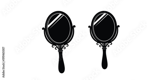 Two black hand mirrors with ornate handles a striking silhouette