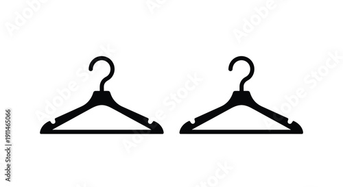 Two black clothes hangers displayed against a white background silhouette